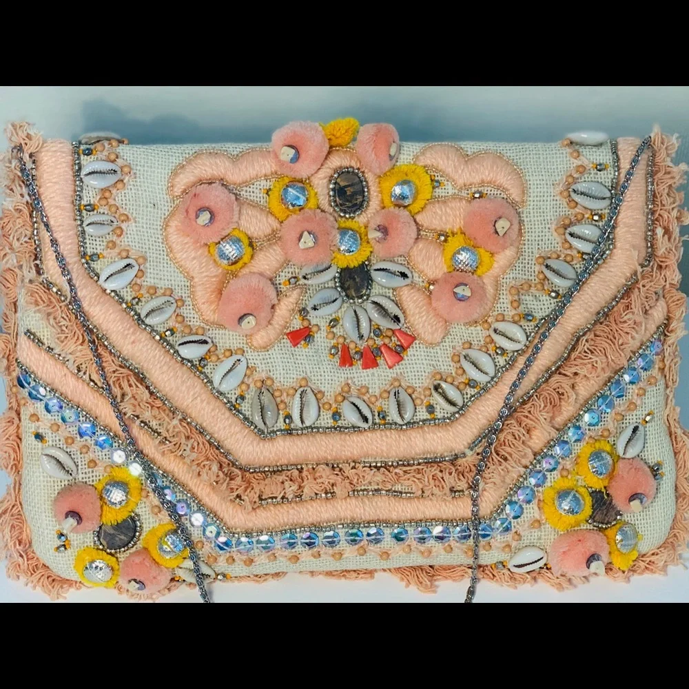 Canvas clutch with coral‎ and yellow pom-poms